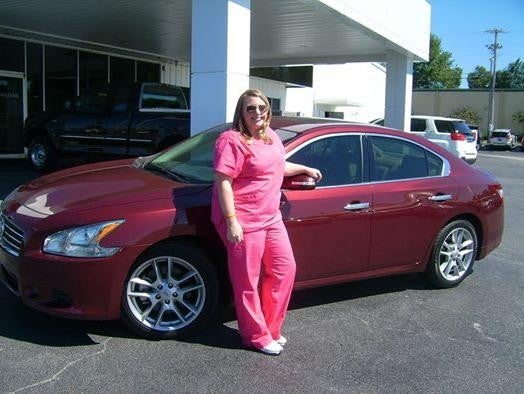 Jenny Burchell next to her new car